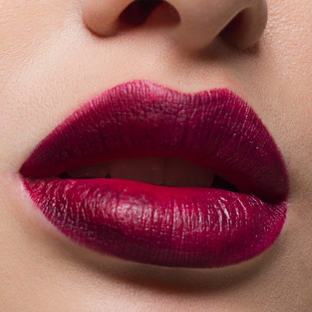 Close-up perfect lip makeup beautiful female mouth. Plump sexy full lips. Macro photo face detail. Perfect clean skin, fresh lip make-up. Sweet pink lipstick, magenta color. Valentine's day style - Фото, зображення