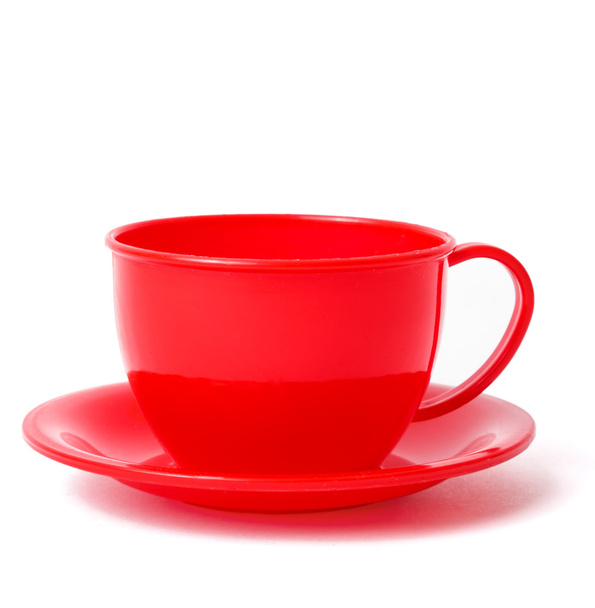 red cup on saucer - Foto, afbeelding