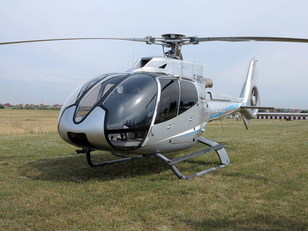 ODESSA, UKRAINE - June 4, 2013: Presentation of the private test light modern civil helicopter business class on a small private airport in the summer on a cloudy day - Foto, Bild