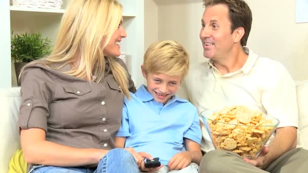 Young Family Watching Movie Together with Snacks - Footage, Video