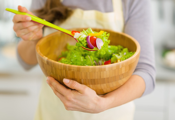 Closeup on fresh vegetable salad in hand of housewife - Φωτογραφία, εικόνα