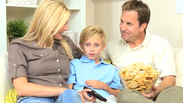 Attractive Family Enjoying TV & Snack Food - Footage, Video