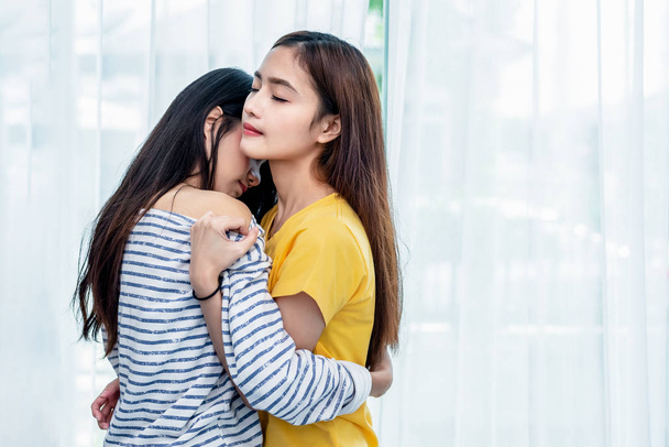 Two Asian Lesbian women looking together in bedroom. Couple people and Beauty concept. Happy lifestyles and home sweet home theme. Embracing of homosexual. Love scene making of female - Photo, Image