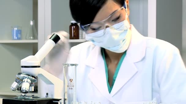 Female Medical Student in Laboratory - Filmati, video