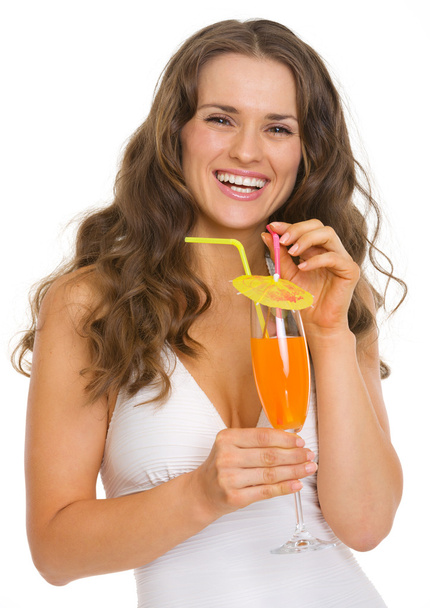 Portrait of happy young woman in swimsuit with cocktail - Фото, изображение