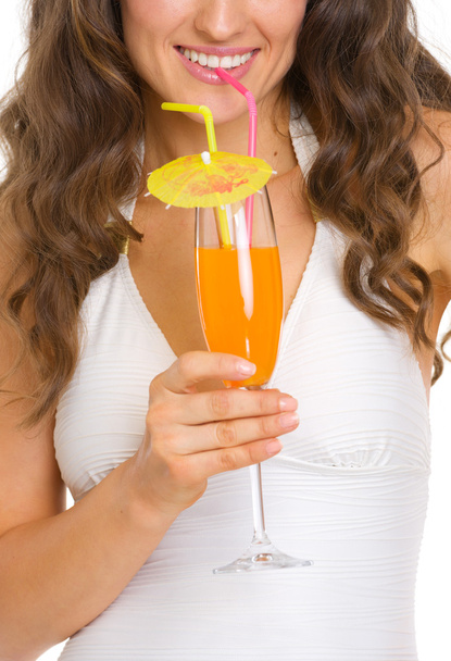 Closeup on young woman in swimsuit drinking cocktail - Fotó, kép
