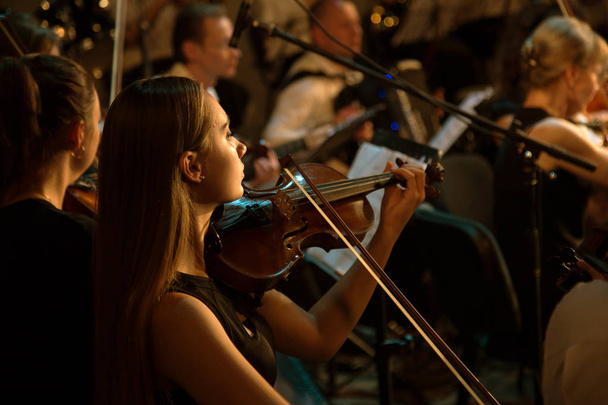 ODESSA, UKRAINE - July 19, 2018: Symphony Orchestra on stage. Musical show on stage of theater. Musicians of symphony orchestra, musical instruments. Jazz band on stage. Selective focus - Photo, Image