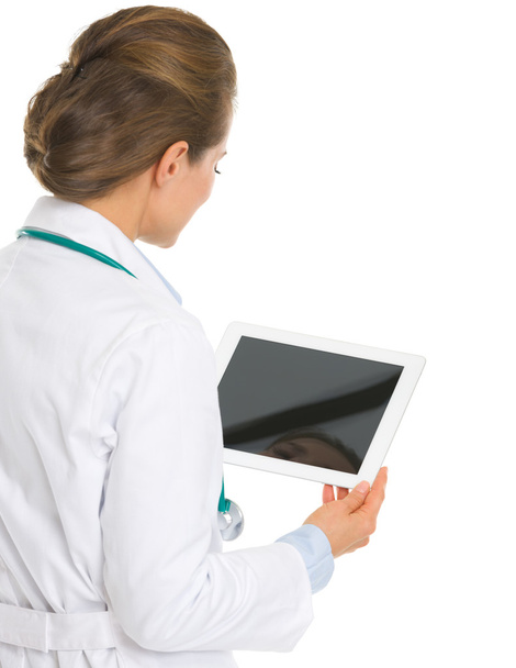 Medical doctor woman using tablet pc . rear view - Foto, Imagem