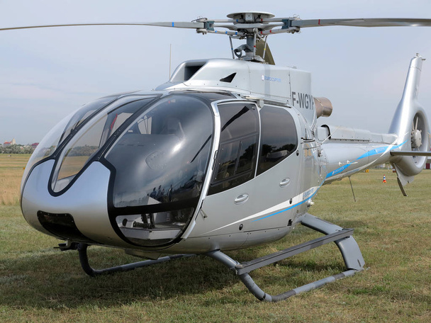 ODESSA, UKRAINE - June 4, 2013: Presentation of the private test light modern civil helicopter business class on a small private airport in the summer on a cloudy day - Fotó, kép