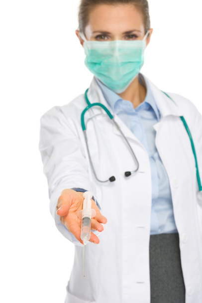 Medical doctor woman in mask showing syringe - Fotografie, Obrázek