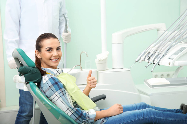 Professional dentist's equipment and blurred doctor with patient on background - Valokuva, kuva