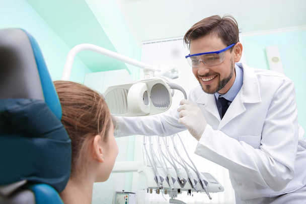 Professional dentist working with patient in modern clinic - Φωτογραφία, εικόνα