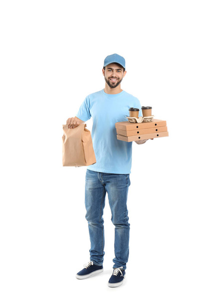 Young courier with different containers on white background. Food delivery service - Foto, Bild