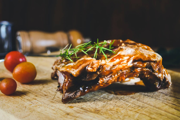 Grilled meat pork ribs on wood table. - Fotoğraf, Görsel
