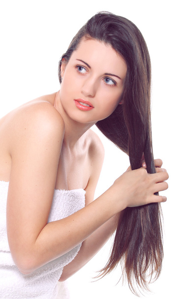 Beautiful girl combing hairs with hands - Fotó, kép