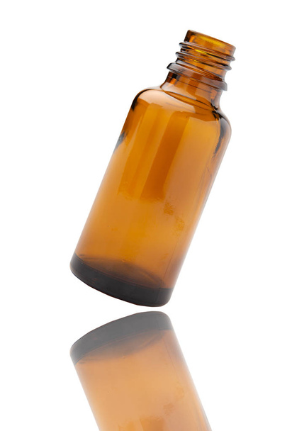 Medicine bottle of brown glass isolated on white background - Foto, imagen