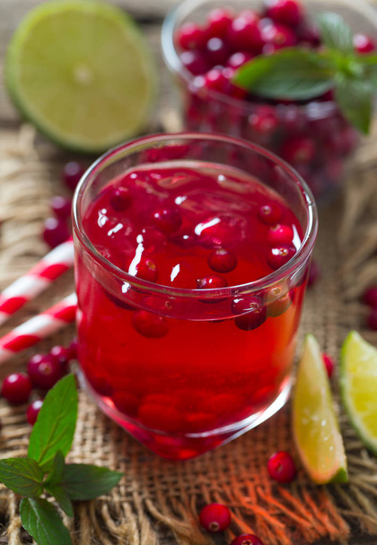 healthy homemade cranberry drink on wooden surface - Foto, Bild