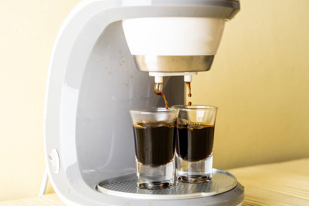 coffee maker machine making coffee on wood background - Zdjęcie, obraz