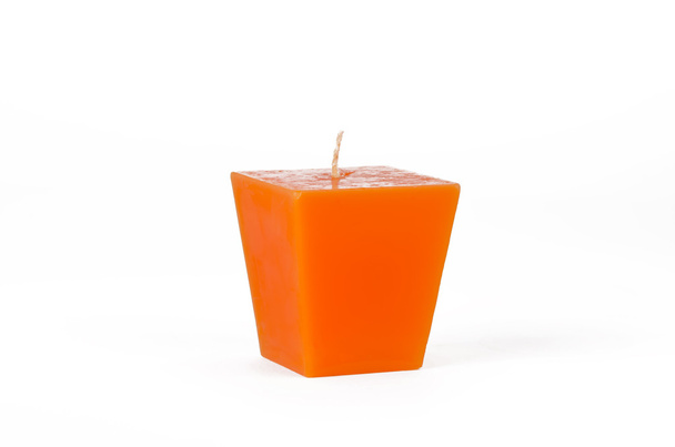 芯でオレンジ色の台形キャンドル - 写真・画像