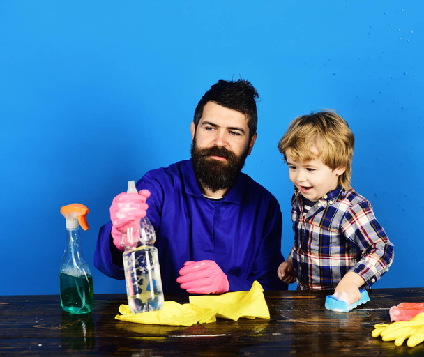 Father and son plays with cleaning props. - Fotó, kép