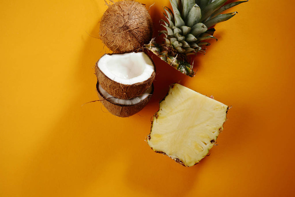 Sliced pineapple and coconuts - Φωτογραφία, εικόνα