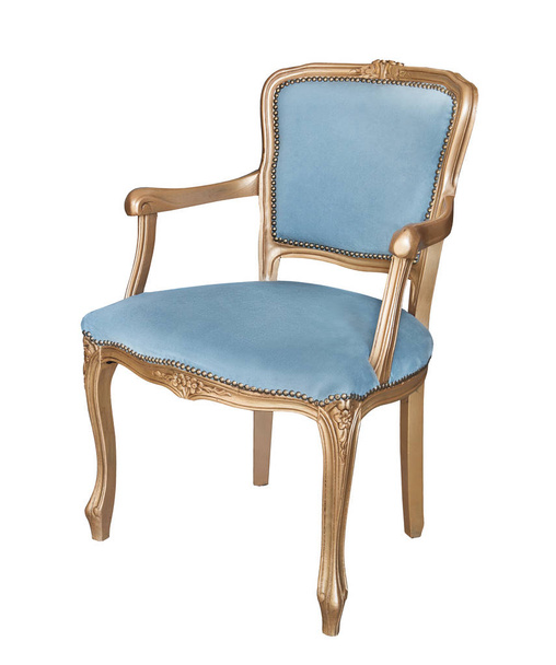 Gorgeous old chair with gold legs and armrests and blue velor padding Isolated on white background. Retro style. Vintage furniture - Photo, Image