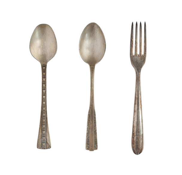Vintage spoons and fork isolated on a white background. Retro silverware. - Photo, Image