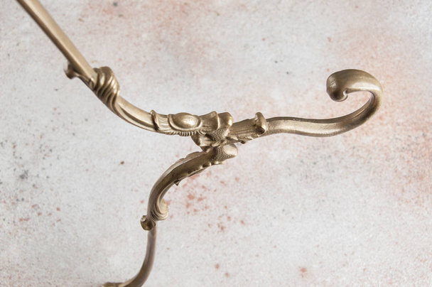 Vintage brass clothes hanger close up - Φωτογραφία, εικόνα