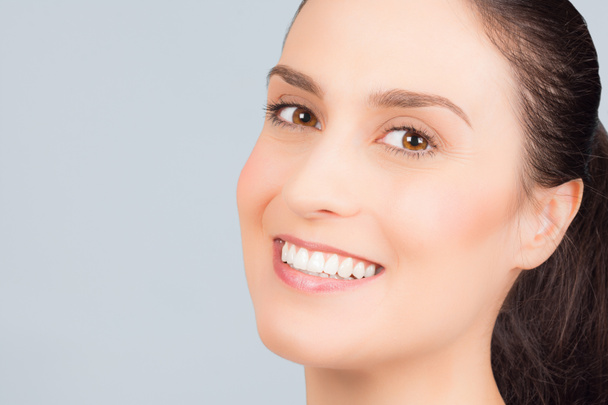 Beautiful smiling woman has perfect skin in 30s, anti-age treatment concept. - Photo, Image