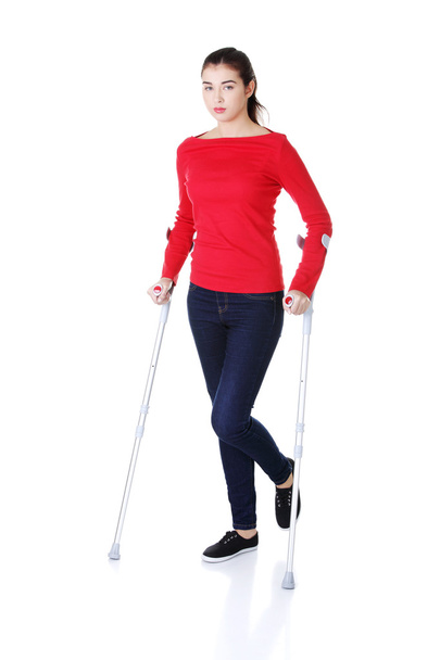 Woman walking with crutches - Foto, Imagem