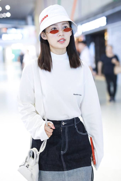 Chinese actress Li Qin arrives at the Shanghai Hongqiao International Airport before departure in Shanghai, China, 14 September 2018. - Фото, изображение