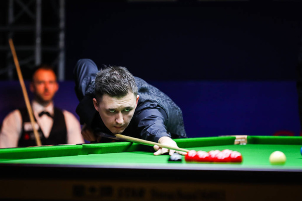 Kyren Wilson of England plays a shot to Judd Trump of England in their second round match during the 2018 Shanghai Masters snooker tournament in Shanghai, China, 11 September 2018 - Valokuva, kuva
