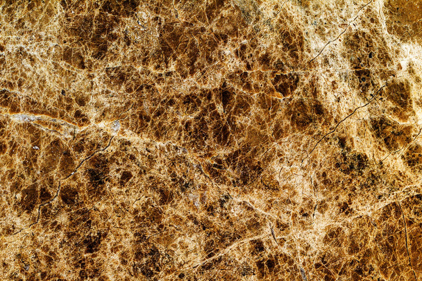красивий старий жовто-коричневий декоративний камінь мармур абстрактні тріщини і плями на поверхні як природний фон
 - Фото, зображення