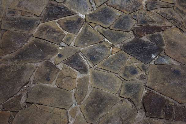 beautiful background laid paving slabs on pedestrian path. Monotonous pattern of multicolored glazed paving slabs. Photo site with paving slabs with small defects and cracks coming out in perspective - Foto, imagen