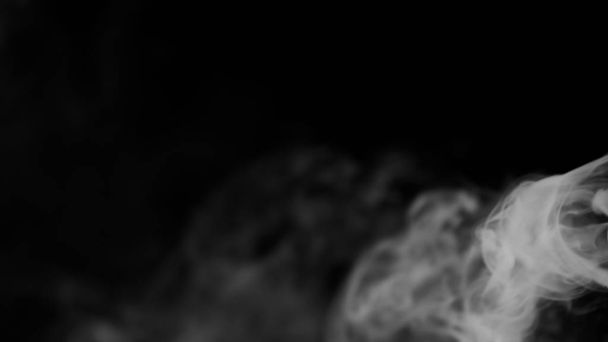 黒を背景に白い煙 - 写真・画像