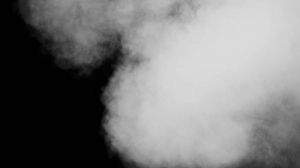 黒を背景に白い煙 - 写真・画像