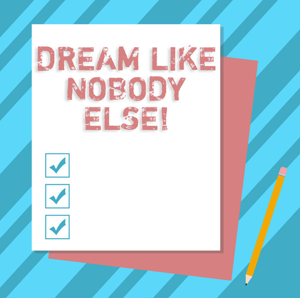Writing note showing Dream Like Nobody Else. Business photo showcasing Have mote motivation inspiration than others Stack of Different Pastel Color Construct Bond Paper Pencil. - Photo, Image