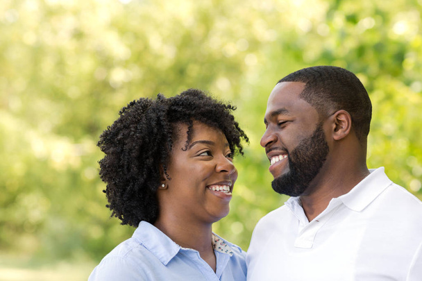 Portrait of a happy African American couple smiling. - Фото, зображення