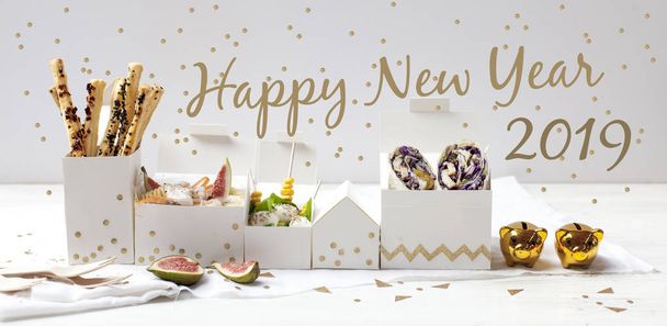 white table with festive food snacks, close-up - Photo, image