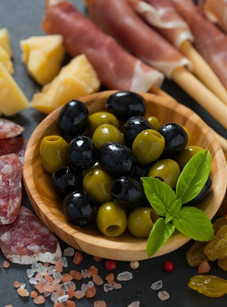 served antipasti wall background close up - Foto, afbeelding