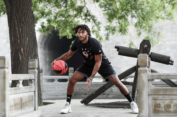 NBA star Derrick Rose of Minnesota Timberwolves plays basketball at the Xi'an Circumvallation of Ming Dynasty in Xi'an city, northwest China's Shaanxi province, 8 August 2018 - Zdjęcie, obraz