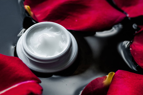 beauty cream jar and flower petals - cosmetics with flowers styled concept, elegant visuals - Photo, image