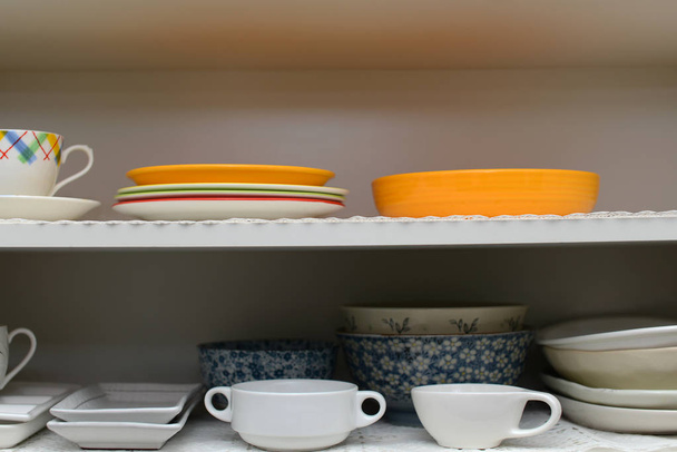 Dishes in cupboard in the kitchen - Foto, Imagen