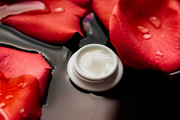 beauty cream jar and flower petals - cosmetics with flowers styled concept, elegant visuals - Photo, Image
