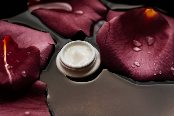 beauty cream jar and flower petals - cosmetics with flowers styled concept, elegant visuals - Фото, зображення