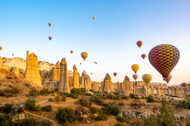 balloons on a background of mountains and dawn in Cappadocia - Fotó, kép