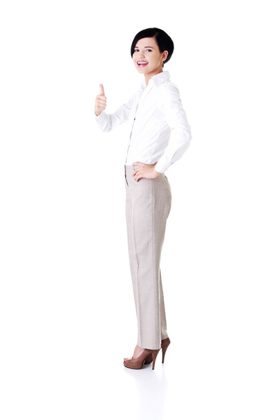 Business woman with ok thumbs up gesture - Foto, Bild