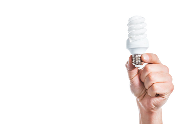 przycięte widzenia świetlówki w ręku mężczyzna na białym tle na białym, pojęcie efektywności energetycznej - Zdjęcie, obraz