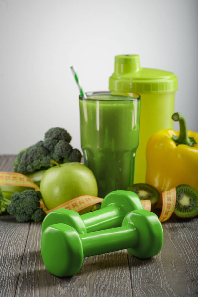 Green dumbbells and food - Photo, image