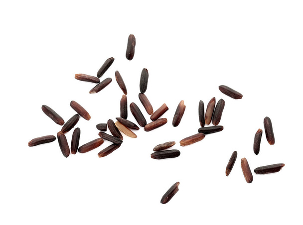 Uncooked black rice on white background, top view - Foto, Bild